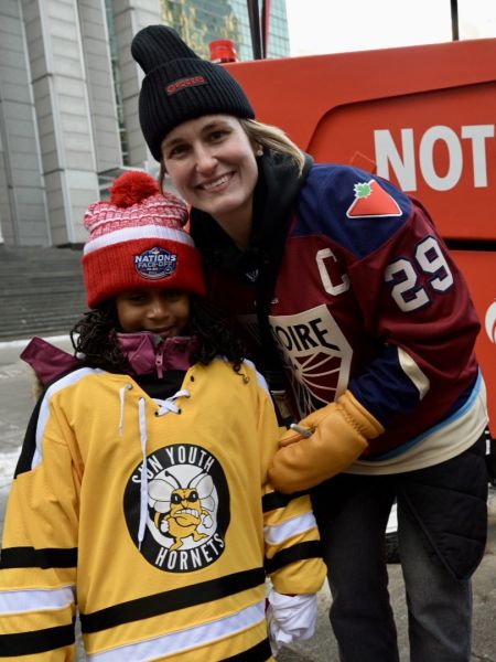 Marie-Philip Poulin and girl - vertical